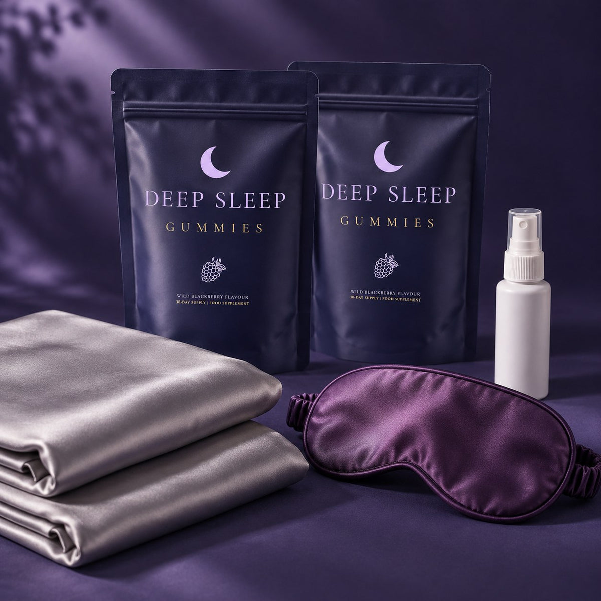 Two Deep Sleep Gummies pouches with satin pillowcases, purple eye mask and white pillow mist